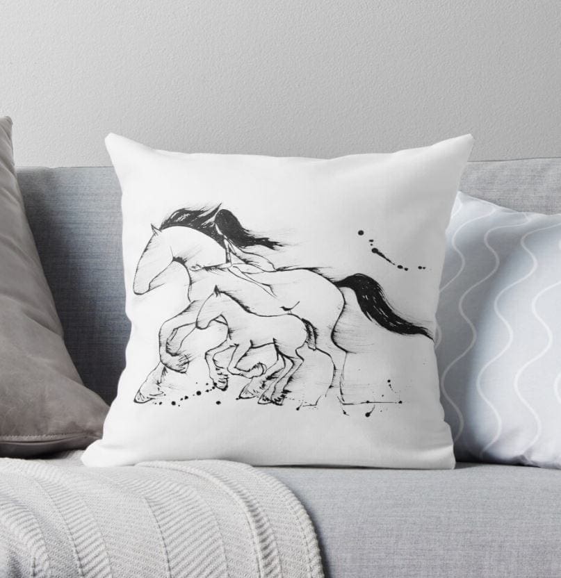 cushion with a horse and foal artwork on it
