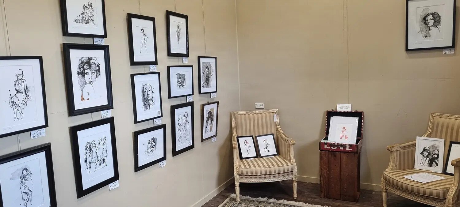 Vintage themed artworks in a boutique gallery space