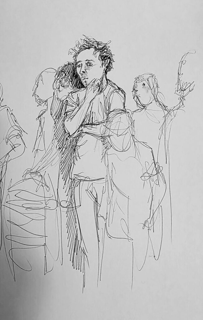 Ink sketch of a knot of standing figures with one man in the middle drawn in detail and the rest as loose line