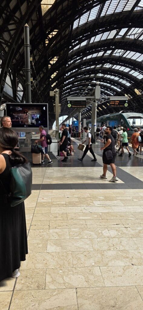 The great iron and glass vaulted train shed of Milano Centrale station