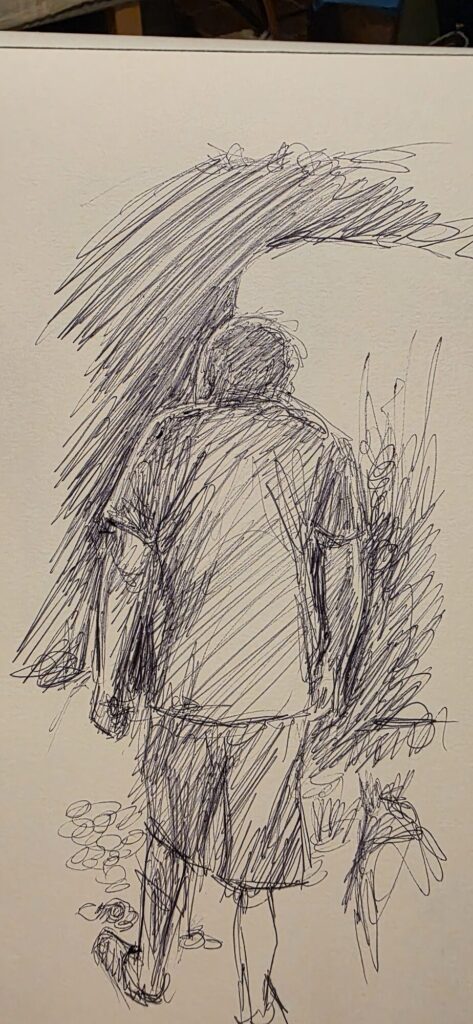 A ballpoint sketchbook page showing a figure in a hooded top seen from behind, heavily hatched, with a big diagonal sweep of dense strokes above and reeds and pebbles below